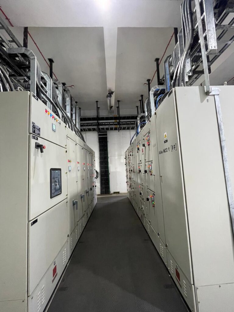 Electrical panels along the equipment-room aisle