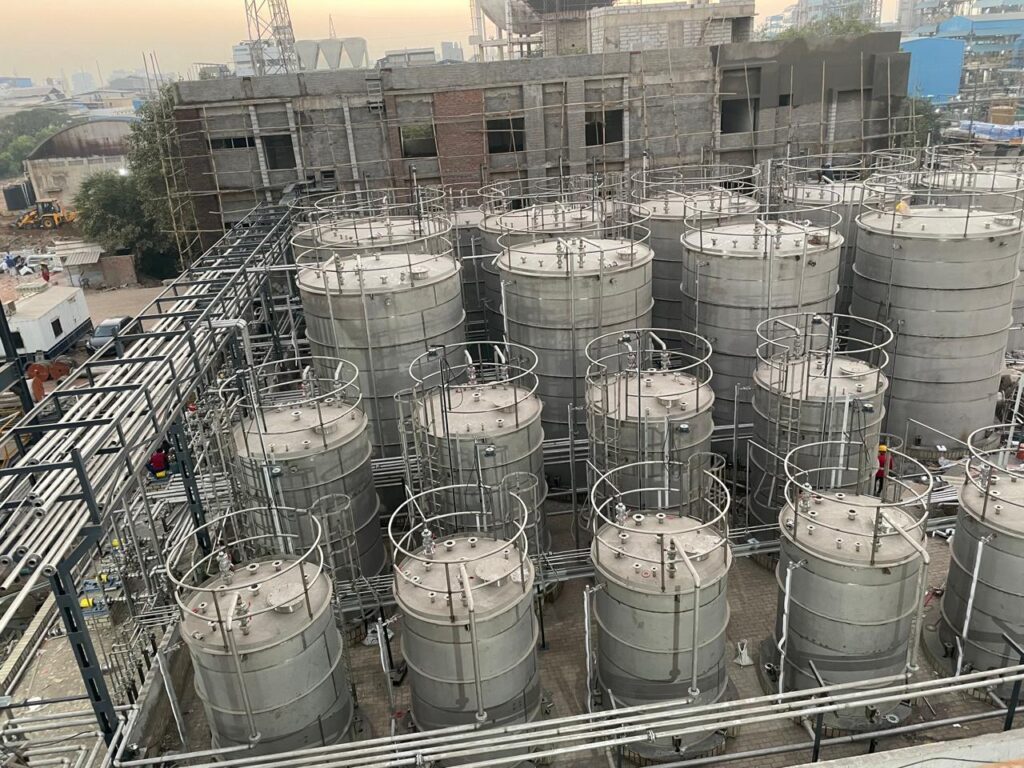 Tank farm with access ladders and pipe racks