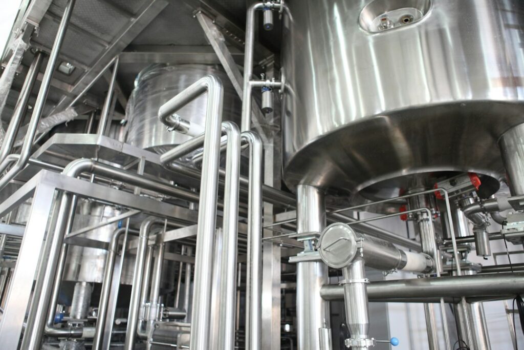 Stainless steel vessels with connecting pipework and access fittings